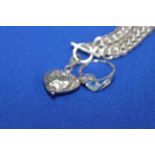 SILVER NECKLACE WITH HEART PENDANT AND AN UNMARKED DRESS RING (2)