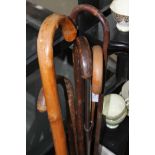 LOT OF WALKING STICKS AND AN OFFICER'S SWORD SCABBARD