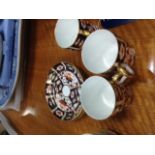 THREE ROYAL CROWN DERBY COFFEE CANS WITH SAUCERS,