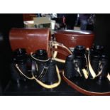 TWO PAIRS OF BINOCULARS WITH LEATHER CASES