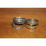 THREE STONE SET ETERNITY RINGS AND A CZ SILVER GILT RING