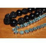 UNUSUAL SWAROVSKI BLACK CRYSTAL NECKLACE formed of graduated smooth and faceted black crystal beads,