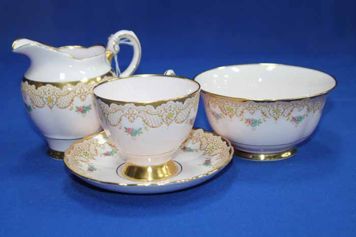 TUSCAN PINK AND GILT FLORAL PATTERN TEA SET with six cups, six saucers,