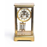 EARLY TWENTIETH CENTURY EIGHT DAY BRASS MANTEL CLOCK retailed by Ducasse Claveau & Co.