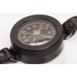 GERMAN WWII LUFTWAFFE BAKELITE PILOT'S COMPASS the black dial with yellow numerals,