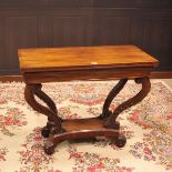 VICTORIAN MAHOGANY OBLONG FOLD OVER TEA TABLE on four moulded scroll supports joined by an