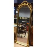 REPRODUCTION GILTWOOD BEVELLED WALL MIRROR with arched top, with moulded floral cresting,