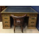 PARTNERS EDWARDIAN OAK PEDESTAL WRITING DESK the top inset a tooled writing surface,