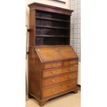 GEORGE III OAK BUREAU WITH ASSOCIATED BOOKCASE TOP the bureau base with fall front writing surface