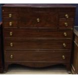 REGENCY MAHOGANY OBLONG SECRETAIRE CHEST OF DRAWERS the central secretaire drawer enclosing a