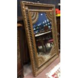 LATE 19TH CENTURY FRENCH CARVED WALNUT WALL MIRROR the mirror plate with applied galleried corners