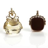 TWO NINE CARAT GOLD FOBS each of swivel form, the first set with a faceted yellow stone,