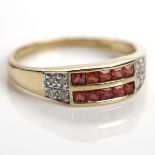 DIAMOND AND GARNET RING channel set with two rows of square red gems,