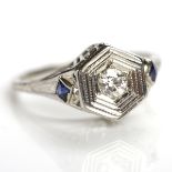 ART DECO DIAMOND AND SAPPHIRE RING of hexagonal design, set with a brilliant cut diamond,