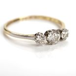 MID-TWENTIETH CENTURY DIAMOND THREE STONE RING the central brilliant cut stone approximately 0.