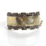 VICTORIAN SILVER AND GILT HARDSTONE BANGLE engraved with bird motifs,