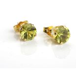 PAIR OF PERIDOT STUD EARRINGS each set with a single round peridot 7mm diameter,