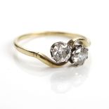 EARLY TWENTIETH CENTURY DIAMOND TWO STONE RING with two brilliant cut stones totalling