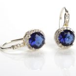 CREATED SAPPHIRE EARRINGS each set with a round created sapphire 5.