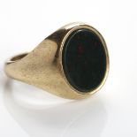 GENTLEMAN'S NINE CARAT GOLD BLOODSTONE SIGNET RING set with an oval bloodstone section measuring