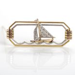 ART DECO YACHT MOTIF BROOCH of octagonal form, with a central diamond set yacht,