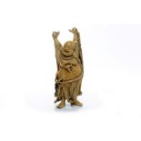 EARLY 20TH CENTURY CHINESE IVORY CARVING of a standing Buddha, smiling with upstretched arms,