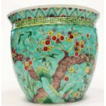 EARLY 20TH CENTURY CHINESE JARDINIERE with blossom overall on a turquoise/green ground, 28cm high,