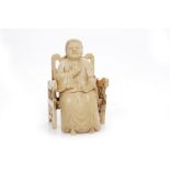 EARLY 20TH CENTURY CHINESE IVORY CARVING of a man seated on a chair, both pieces signed,