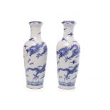 PAIR OF MID 20TH CENTURY CHINESE BLUE AND WHITE VASES each with two dragons,