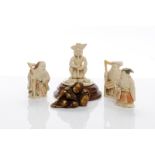 FOUR EARLY 20TH CENTURY JAPANESE IVORY NETSUKE three modelled as a standing figure,