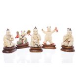 FIVE EARLY 20TH CENTURY CHINESE IVORY CARVINGS each modelled as a figure on wood stand,