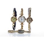 GROUP OF FOUR LADY'S TWENTIETH CENTURY WRISTWATCHES comprising a nine carat gold example with