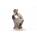 LARGE LLADRO BISQUE FIGURE modelled as a girl resting on a tree branch over a naturalistic base,