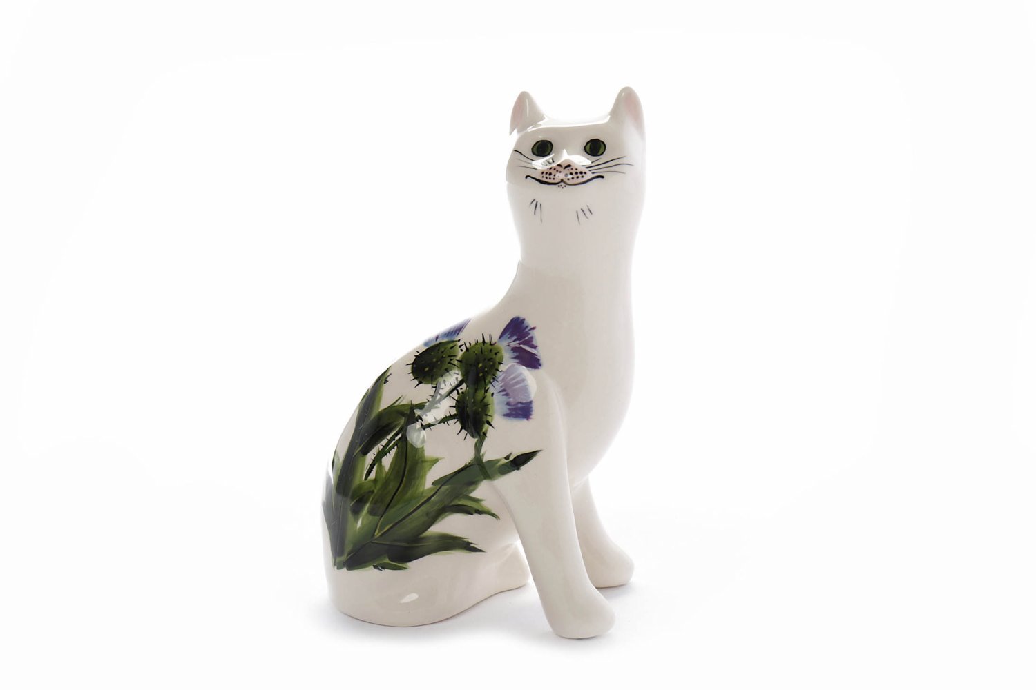 GRISELDA HILL WEMYSS POTTERY CAT with thistle decoration, black painted marks to base,