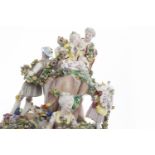 LATE 19TH CENTURY LARGE DRESDEN FIGURAL CENTREPIECE modelled as six figures on a rock with floral