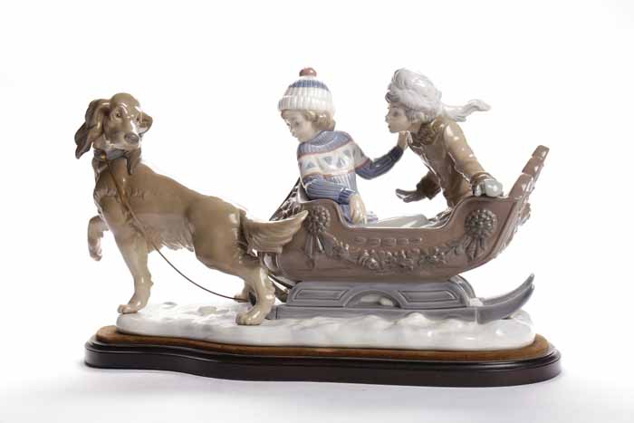 LARGE LLADRO GROUP modelled as two children in a sleigh being pulled by a dog, blue printed mark,