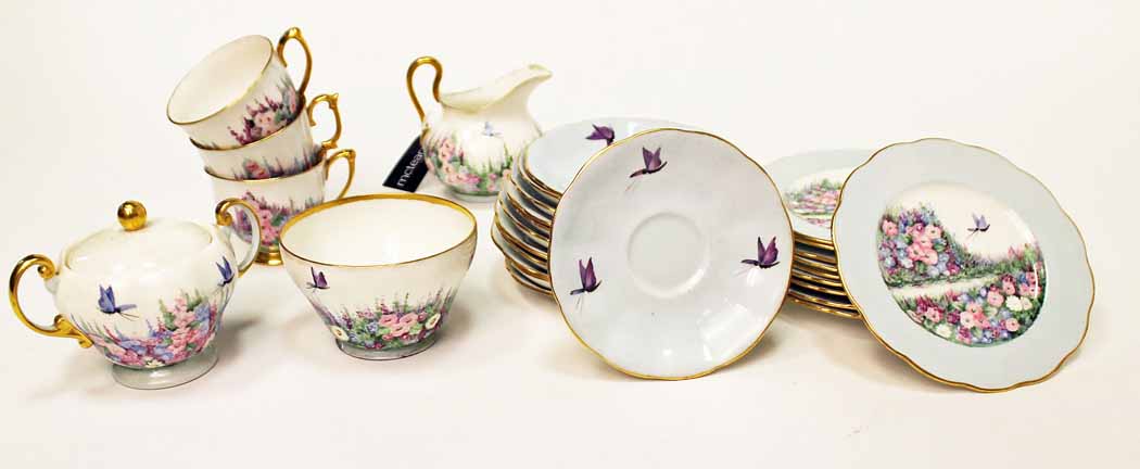 TWO MID 20TH CENTURY HAND PAINTED TEA SETS all painted by a lady artist named 'M Chalmers',