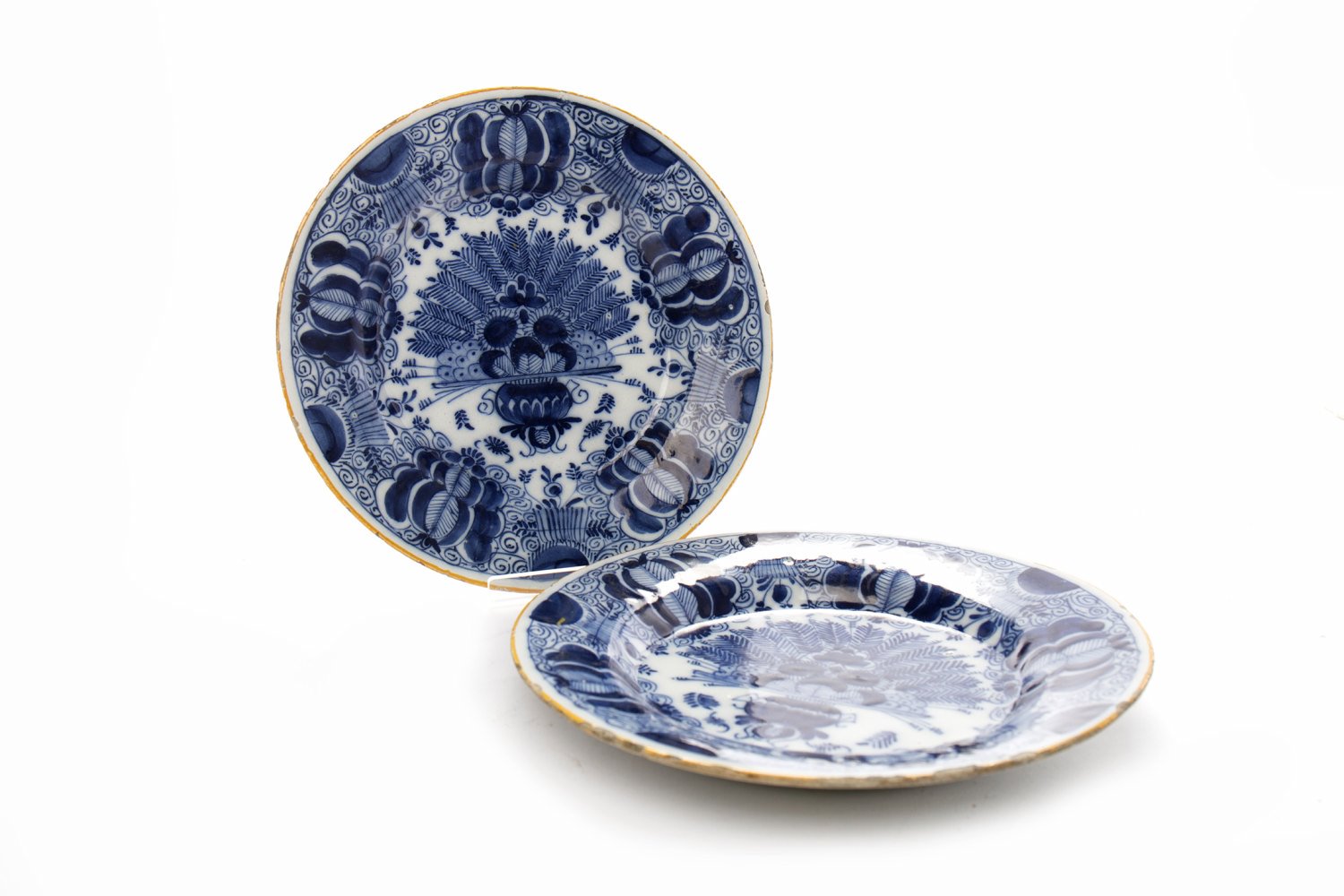 PAIR OF LATE 18TH CENTURY DUTCH DELFT PLATES painted with blue scrolling floral design,