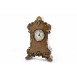 EARLY TWENTIETH CENTURY BURR WALNUT MANTEL CLOCK OF ROCOCO DESIGN with Arabic numeral enamelled