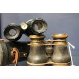 PAIR OF COMPASS BINOCULARS The compass mounted between the eyepieces, ebonised finish, 17cm long,