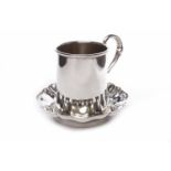 SILVER CHRISTENING MUG with a scroll handle, and stepped circular base, maker Crisford & Norris Ltd,