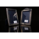 TWO SMALL MODERN UPRIGHT SILVER PHOTOGRAPH FRAMES with beaded borders, one with arched top,
