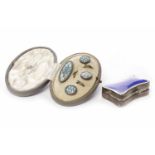 EDWARDIAN SILVER AND ENAMEL PILL BOX of shaped rectangular form,