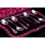 FIVE CASED SETS OF SILVER CUTLERY comprising six coffee with pierced terminals, maker Emile Viner,