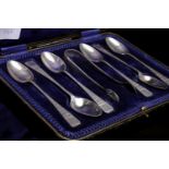 SET OF TWELVE SILVER SCROLL END COFFEE SPOONS with matching tongs,