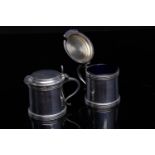 PAIR OF SILVER DRUM MUSTARD POTS OF QUEEN ANNE DESIGN the hinged covers with acorn thumbpiece and