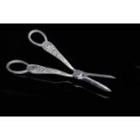 PAIR OF GEORGE V SILVER GRAPE SCISSORS chased with scrolls and leafage,