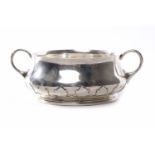 GEORGE V SILVER BABY'S BOWL of double handled circular baluster form, with a leaf cast border,