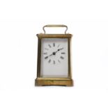 FRENCH BRASS CARRIAGE CLOCK the enamelled dial with Roman numeral dial and blued steel hands,