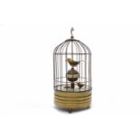 CLOCKWORK BIRD AUTOMATON featuring a larger carved painted wooden bird resting on an orb,